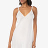 woman wearing a white slip on a white background
