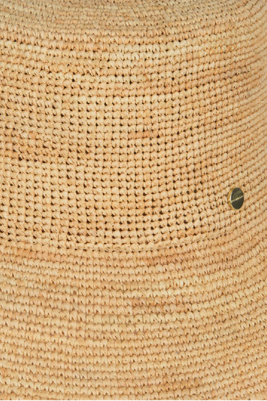 a close up of the texture of a straw bucket hat