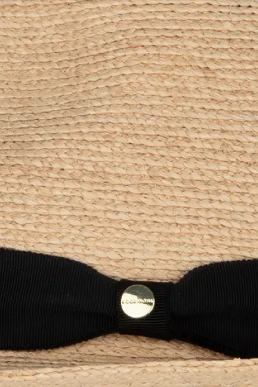 a close up natural fedora on a neutral background 