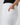 White pants with a pocket detail on a plain background