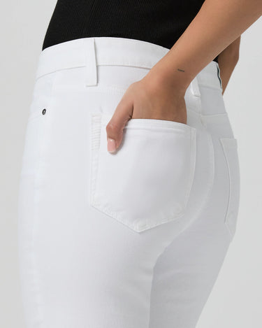 White pants with a pocket detail on a plain background