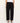 Person wearing black wide-leg pants on a white background