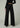 Back view of Joe’s Jeans Lou Lou Wide Leg Jean in Black showing low-rise waist, back pockets and wide leg