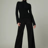 Joe’s Jeans Lou Lou Low Rise Wide Leg Jean in Black styled with a fitted black turtleneck and heels