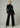 Joe’s Jeans Lou Lou Low Rise Wide Leg Jean in Black styled with a fitted black turtleneck and heels