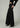 Side view of Joe’s Jeans Lou Lou Low Rise Wide Leg Jean in Black showing relaxed fit and full-length wide leg