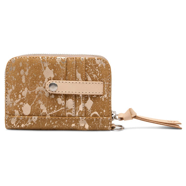 A zip-around wallet in a distressed tan leather finish with a paint-splatter pattern, featuring a light tan leather strap covering the card holders on the front and a matching wristlet strap.
