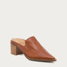 A single tan leather mule shoe with a pointed toe and a stacked wood-look block heel, shown from a three-quarters angle on a light gray background.