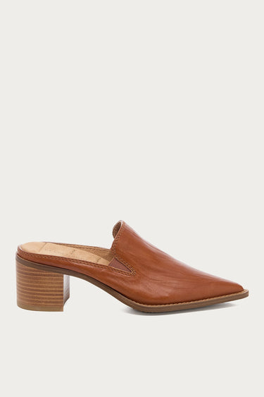 A single brown leather mule shoe with a pointed toe and a stacked wood-look block heel, shown in side profile against a light gray background.