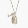 A close-up of a sterling silver necklace with a rectangular lock pendant featuring a keyhole and an ornate key charm, against a bright white background.