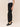 Side view of Bella Dahl Pull-On Elastic Waist Trouser in black faux leather, showing the elastic waistband, smooth silhouette and ankle-length straight leg.