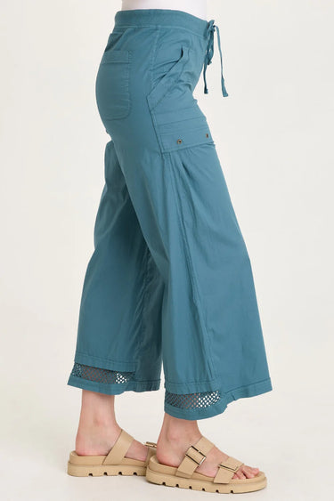 Teal pants with drawstring waist on a white background