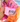 Person holding a pink pouch with 'SWIM' text, wearing an orange and pink outfit.