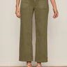 Person wearing olive green pants on a plain background