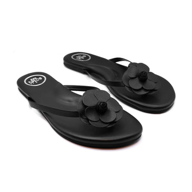 Black valentina flip-flops with flower details on a white background